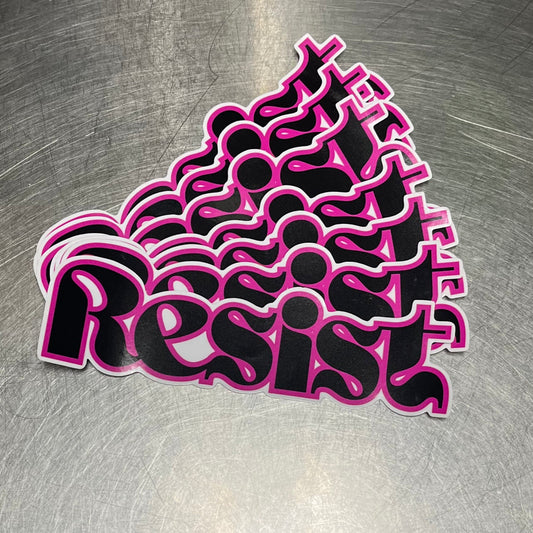 Pink 'Resist' sticker on a metallic surface